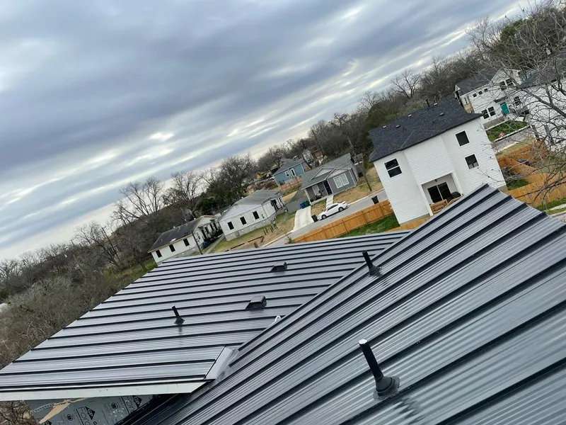 Standing seam metal roof panels with vents for Skylight Repair in Addison